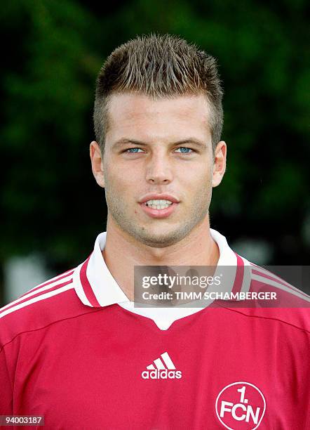 First division Bundesliga football club 1.FC Nuremberg's defender Dennis Dieckmeier poses for photographers during the team presentation on July 8,...