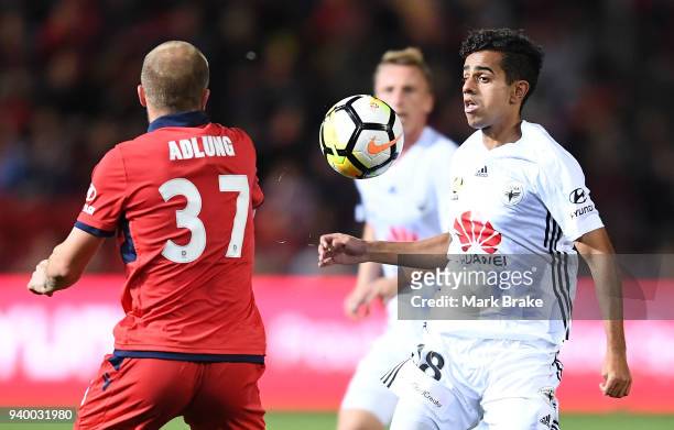 Daniel Adlung of Adelaide United competes with Sarpreet Singh of Wellington Phoenix during the round 25 A-League match between Adelaide United and...