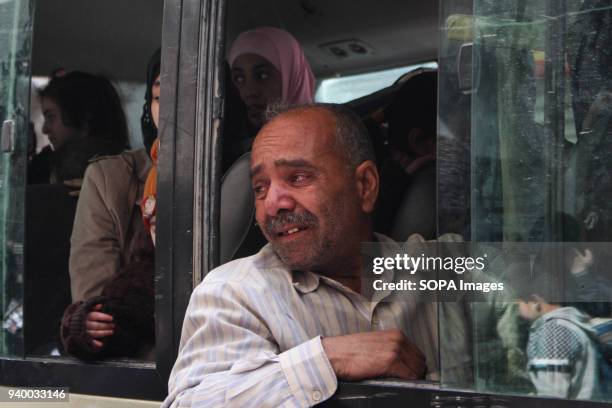 Man weeps after he has let his family go to Damascus ,According to reports, civilians, mostly ill people and injured that need urgent medical...