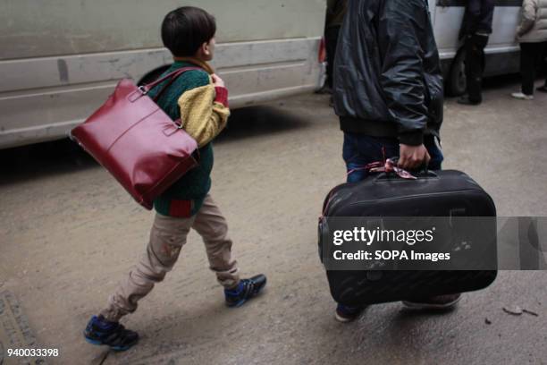 Child seen carrying a handbag as he evaluates to Damascus. According to reports, civilians, mostly ill people and injured that need urgent medical...