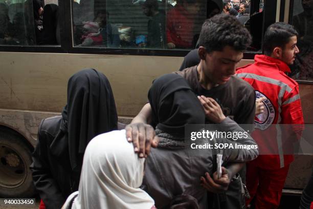 Man seen saying goodbye to his family. According to reports, civilians, mostly ill people and injured that need urgent medical attention, were...