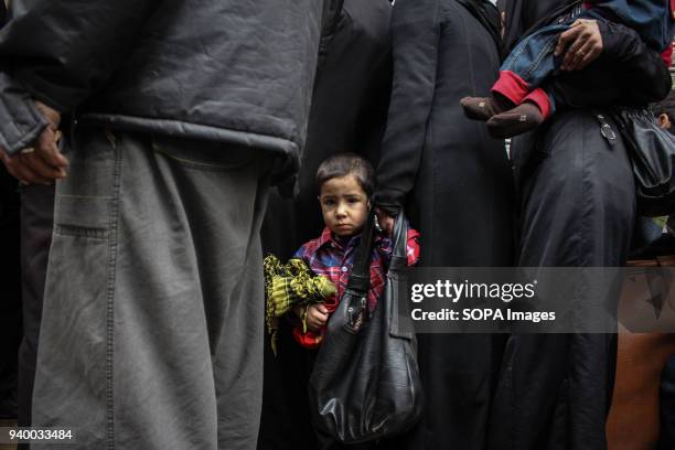 Child seen before getting on a evacuation bus. According to reports, civilians, mostly ill people and injured that need urgent medical attention,...