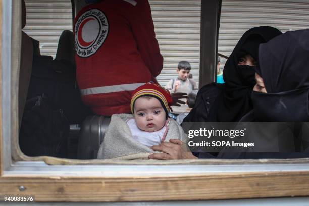Mother seen with her baby on board a evacuation bus. According to reports, civilians, mostly ill people and injured that need urgent medical...
