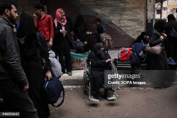 Disabled woman seen waiting for the evacuation bus. According to reports, civilians, mostly ill people and injured that need urgent medical...