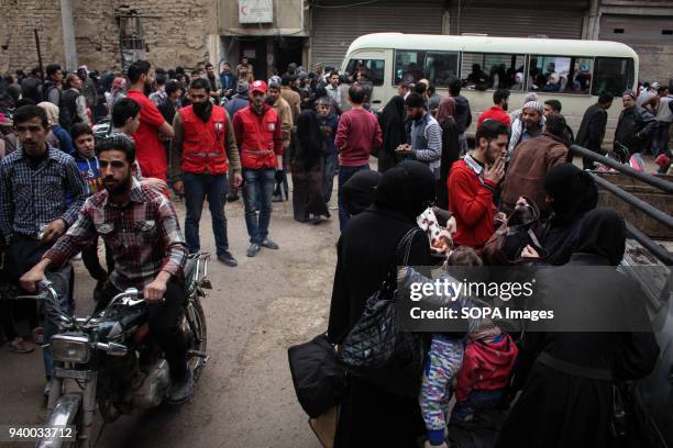 Members of the Syrian Red Crescent seen overseeing the evacuation. According to reports, civilians, mostly ill people and injured that need urgent...