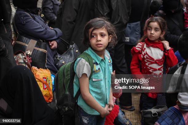 Children seen waiting for the evacuation bus. According to reports, civilians, mostly ill people and injured that need urgent medical attention, were...