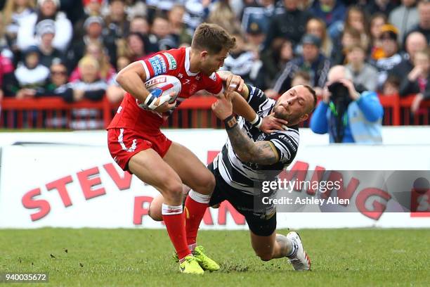 Chris Atkin of Hull KR pushes aside Josh Griffin of Hull FC during the BetFred Super League match between Hull KR and Hull FC at KCOM Craven Park on...