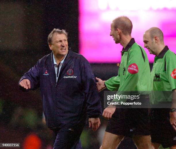 Neil Warnock, manager of Sheffield United , argues with referee Mike Riley during the Barclays Premiership match between West Ham United and...