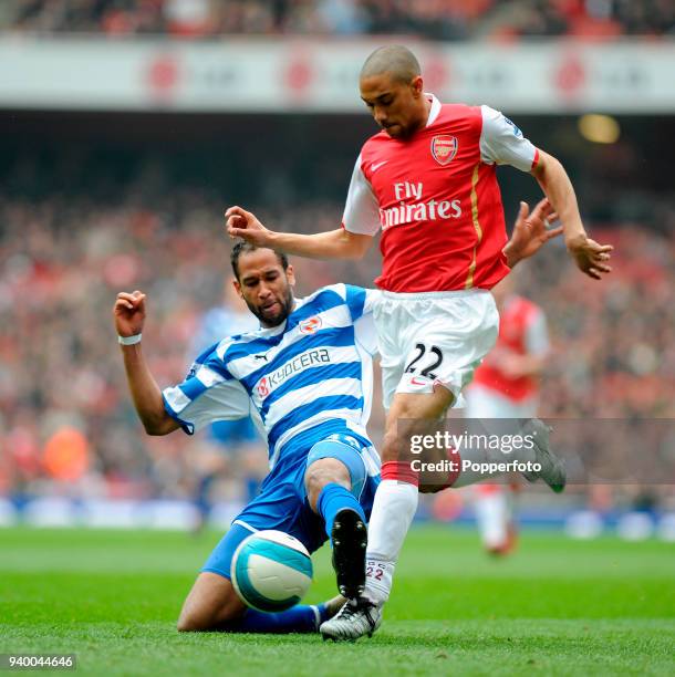 Gael Clichy of Arsenal is tackled by Jimmy Kebe of Reading during the Barclays Premier League match between Arsenal and Reading at the Emirates...