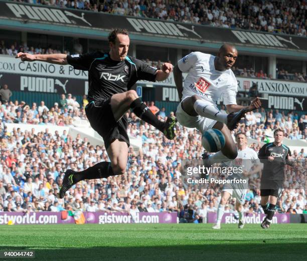 Darren Bent of Tottenham Hotspur and Andy O'Brien of Bolton Wanderers battle for the ball during the Barclays Premier League match between Tottenham...