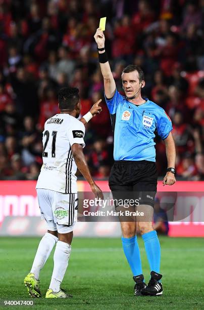 Roy Krishna of Wellington Phoenix gets a yellow card during the round 25 A-League match between Adelaide United and the Wellington Phoenix at Coopers...