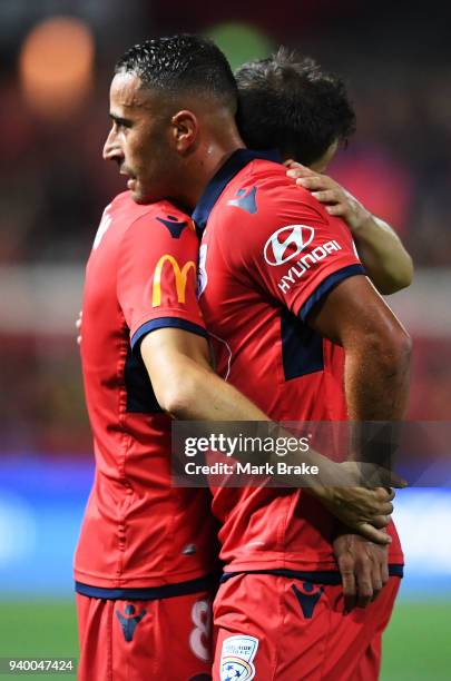 Isaias of Adelaide United hugs Tarek Elrich of Adelaide United dat the end of the round 25 A-League match between Adelaide United and the Wellington...