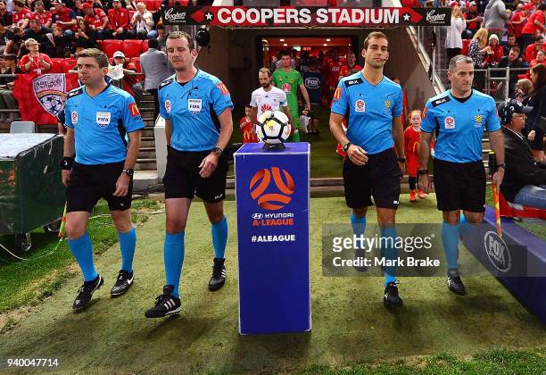 Match Referees head onto the pitch during the round 25 A-League match between Adelaide United and the Wellington Phoenix at Coopers Stadium on March...