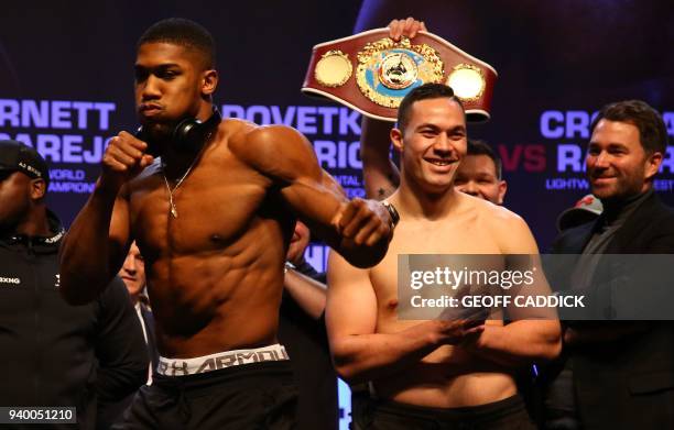 Britain's Anthony Joshua and New Zealand's Joseph Parker attend a weigh-in photocall at the Motorpoint Arena in Cardiff, south Wales on March 30,...