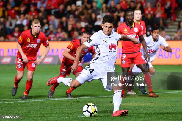 Logan Rogerson of Wellington Phoenix scores a penalty past Paul Izzo of Adelaide United during the round 25 A-League match between Adelaide United...