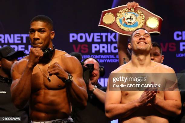 Britain's Anthony Joshua and New Zealand's Joseph Parker attend a weigh-in photocall at the Motorpoint Arena in Cardiff, south Wales on March 30,...