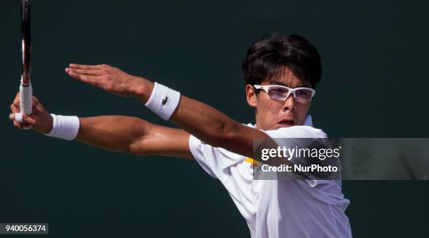 Hyeon Chung, from Korea, in action during his fourth round match against John Isner, from the USA. Isner finally prevailed and defeated Chung 6-1,...