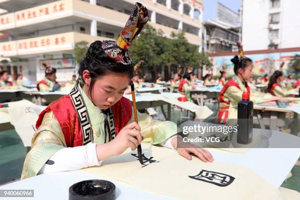 Students of Huaibei City Gucheng Road Primary School attend a calligraphy competition on March 30, 2018 in Huaibei, Anhui Province of China.