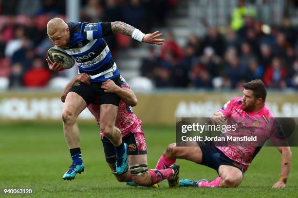 Tom Homer of Bath is tackled by Greg Holmes of Exeter Chiefs during the Anglo-Welsh Cup Final between Bath Rugby and Exeter Chiefs at Kingsholm...