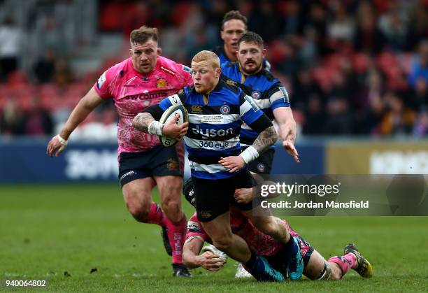 Tom Homer of Bath is tackled by Greg Holmes of Exeter Chiefs during the Anglo-Welsh Cup Final between Bath Rugby and Exeter Chiefs at Kingsholm...