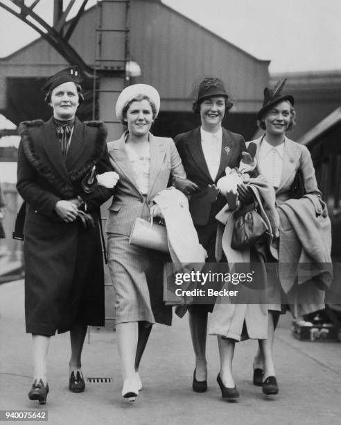 The South African women's lawn tennis team arrive at Waterloo Station in London, 6th May 1938. From left to right, Bobbie Heine Miller , Margaret...