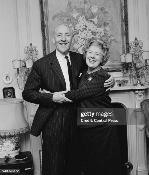 British actress Cicely Courtneidge and her husband, actor Jack Hulbert at home in London on their Golden Wedding anniversary, 14th February 1966.
