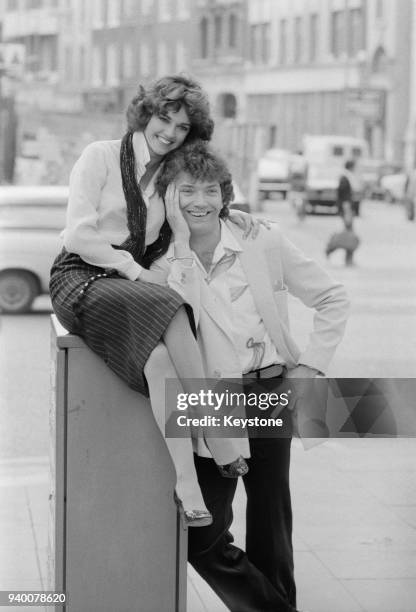 Actors Martin Shaw and Gemma Craven, stars of the stage musical 'They're Playing Our Song', pose outside the Shaftesbury Theatre in London during a...