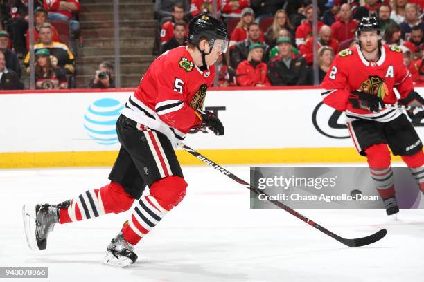 Connor Murphy of the Chicago Blackhawks chases the puck in the third period against the Boston Bruins at the United Center on March 11, 2018 in...