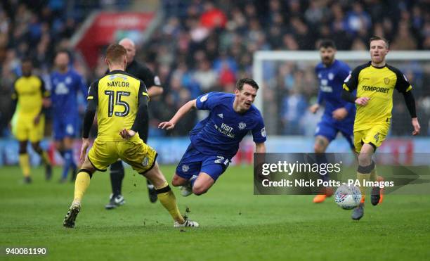 Burton Albion's Tom Naylor challenges Cardiff City's Craig Bryson during the Sky Bet Championship match at the Cardiff City Stadium.