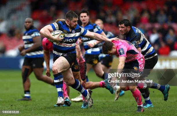 Shaun Knight of Bath is challenged by Joe Simmonds of Exeter Chiefs during the Anglo-Welsh Cup Final between Bath Rugby and Exeter Chiefs at...