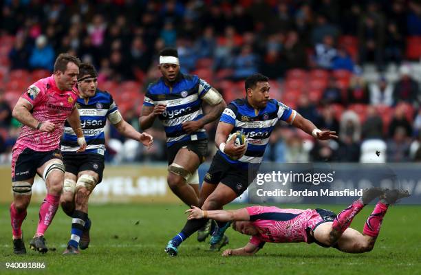 Cooper Vuna of Bath is tackled by Stuart Townsend of Exeter Chiefs during the Anglo-Welsh Cup Final between Bath Rugby and Exeter Chiefs at Kingsholm...