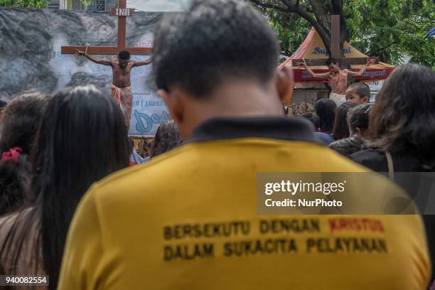 Indonesian Catholic devotees participate in a re-enactment of the crucifixion of Jesus Christ on Good Friday procession at Church of Santa Maria A....