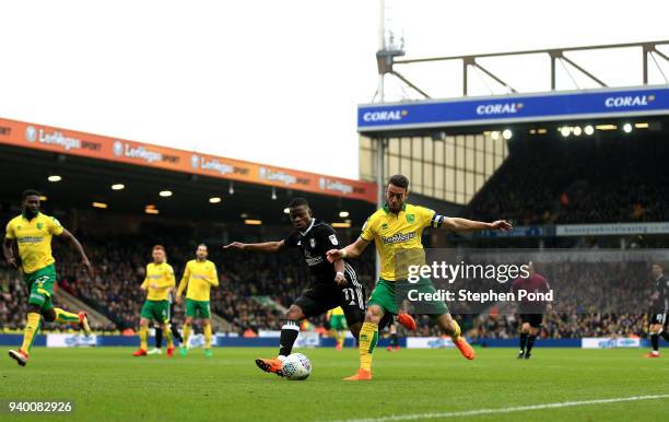 Ivo Pinto of Norwich City and Floyd Ayite of Fulham compete for the ball during the Sky Bet Championship match between Norwich City and Fulham at...