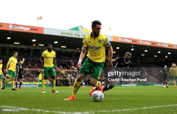 Ivo Pinto of Norwich City and Floyd Ayite of Fulham compete for the ball during the Sky Bet Championship match between Norwich City and Fulham at...