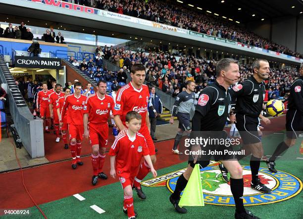 Steven Gerrard captain of Liverpool and Ryan Nelsen captain of Blackburn Rovers lead their teams out before the Barclays Premier League match between...