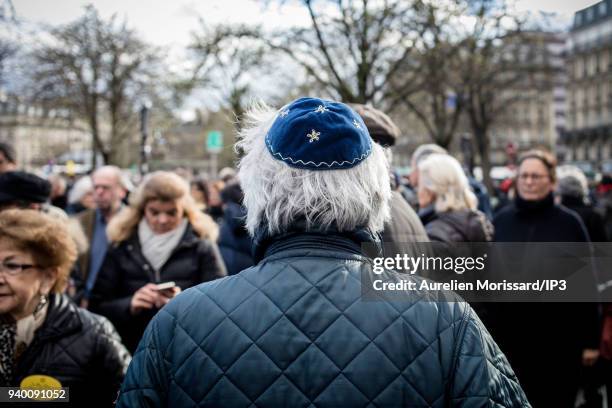 People attend the Silent March In Memory Of Mireille Knoll who survived the Holocaust but was recently murdered in her home on March 28, 2018 in...