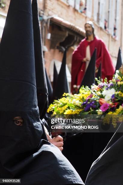 Cortege of penitents take part in the traditional 'Sanch' procession in the centre of Perpignan on March 30 as they commemerate the crucifixtion of...