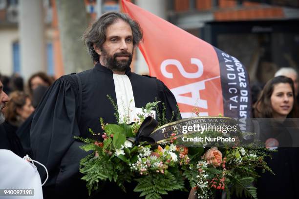 The vice-prsident of the Bar Association carries a mortuary wreath symbolizing the death of Justice.The French Bar Association, all lawyers' unions,...