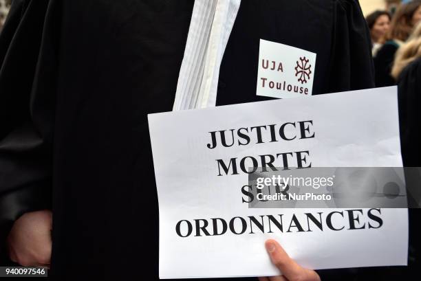 The placard reads 'Justice dead on prescription'. The French Bar Association, all lawyers' unions, all magistrates' unions called all its members to...