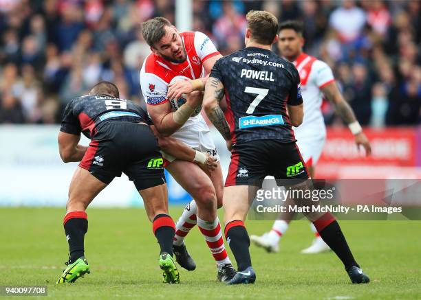 St Helens' Luke Douglas takes on Wigan Warriors' Sam Powell during the Super League match at the Totally Wicked Stadium, St Helens.