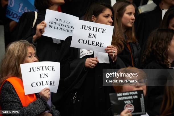 Lawyers hold placards reading 'Angry Justice'. The French Bar Association, all lawyers' unions, all magistrates' unions called all its members to be...