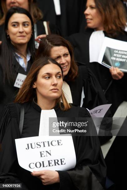 Lawyer holds a placard reading 'Angry Justice'. The French Bar Association, all lawyers' unions, all magistrates' unions called all its members to be...