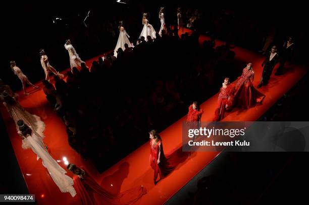 Models walk the runway at the Mehmet Korkmaz show during Mercedes Benz Fashion Week Istanbul at Zorlu Performance Hall on March 30, 2018 in Istanbul,...