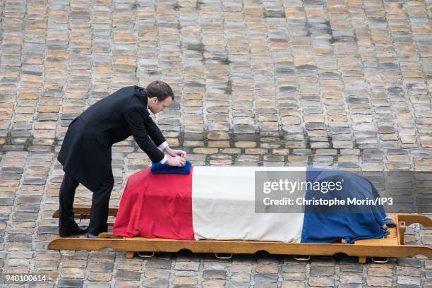 President of the Republic Emmanuel Macron attends a national tribute to Colonel Arnaud Beltrame at Hotel des Invalides on March 28, 2018 in Paris,...