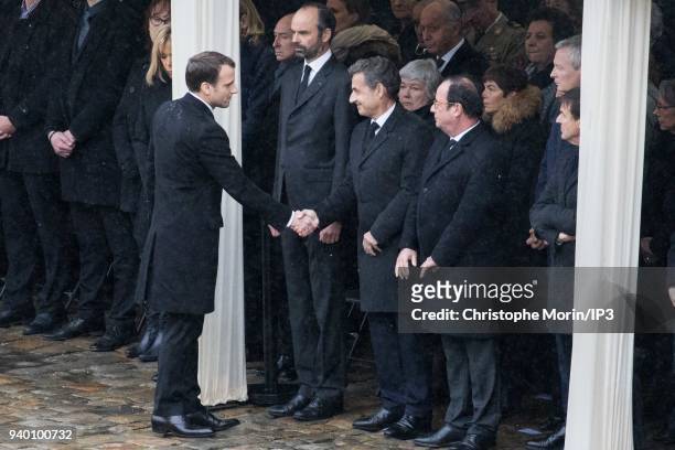 President of the Republic Emmanuel Macron greets former presidents of the republic Francois Hollande and Nicolas Sarkozy during a national tribute to...