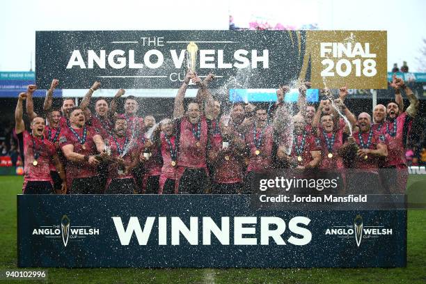 Kai Horstmann of Exeter Chiefs lifts the Anglo-Welsh trophy and celebrates with team mates after winning the Final between Bath Rugby and Exeter...