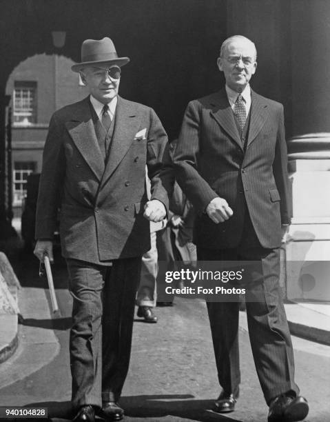 Sir Stafford Cripps , Chancellor of the Exchequer, with Lewis Williams Douglas , the US Ambassador to the UK, after a discussion on US-UK economics...