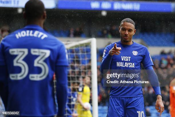 Kenneth Zohore of Cardiff City celebrates scoring his sides first goal of the match with Junior Hoilett during the Sky Bet Championship match between...