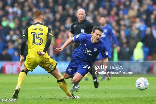 Craig Bryson of Cardiff City is tackled by Tom Naylor of Burton Albion during the Sky Bet Championship match between Cardiff City and Burton Albion...