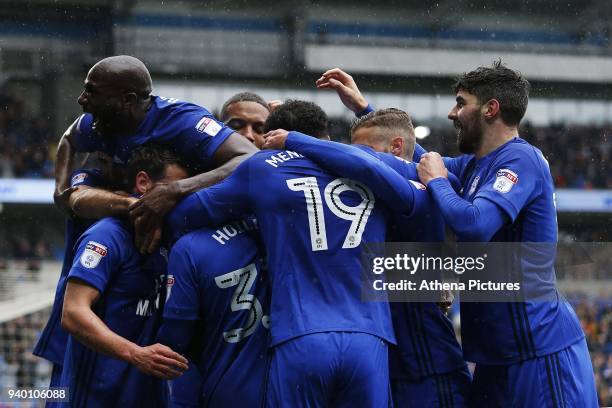 Sol Bamba of Cardiff City joins Kenneth Zohore of Cardiff City celebrates scoring his sides first goal of the match with Junior Hoilett during the...